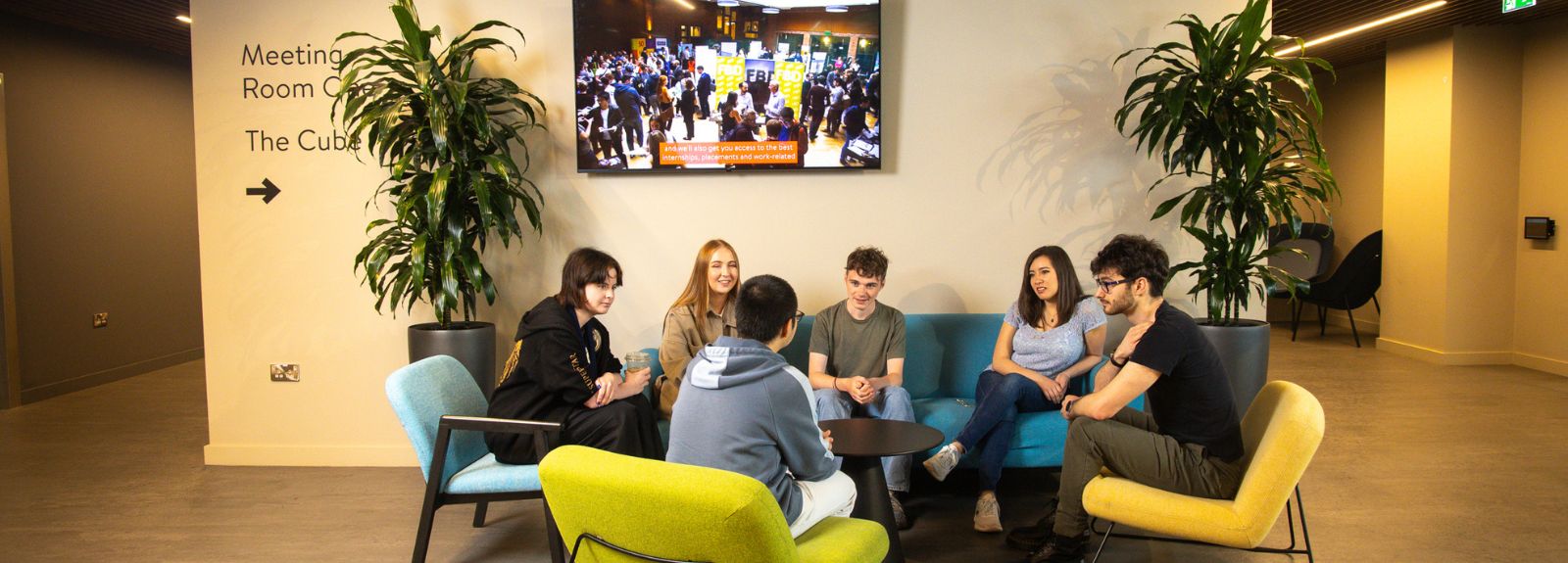 students sitting around a table chatting